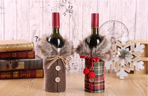 Detailed view of Christmas wine bottle covers in plaid and herringbone fabrics with fur collars