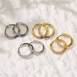 Gold and silver hoop earrings featuring colorful rainbow and clear zircon pavé stones