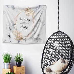 Detail of marble tapestry with golden fern leaves and inspirational quotes on wall