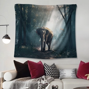Bohemian forest elephant tapestry hanging on a wall above a sofa for room decor