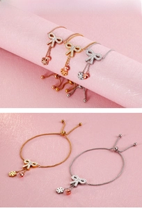 Detail of adjustable butterfly tassel bracelet with sliding buckle in three metal finishes