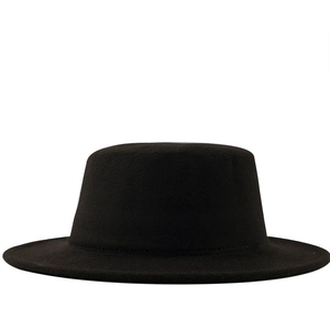 Detailed view of the flat crown and stiff wool felt texture of the black boater hat