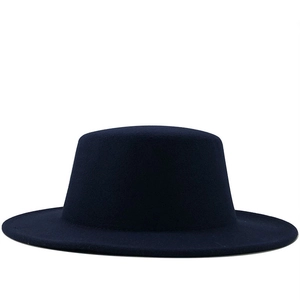 Detail shot of the wide brim and flat top structure of this dark blue wool fedora hat