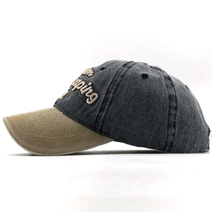 Detail of vintage-style cotton baseball cap with Camping embroidery and khaki brim