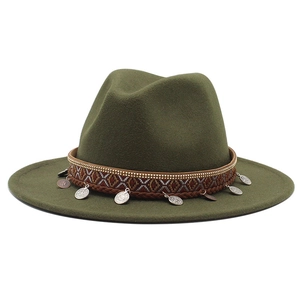 Detail view of olive green wool fedora with ethnic embroidery and metal coin pendants