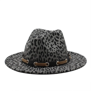 Detail of leopard print jazz hat featuring grey felt fabric and studded leather band