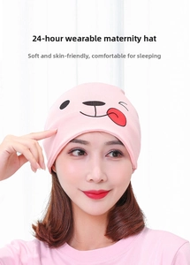 Detailed close-up of a pink confinement hat for women featuring a cute cartoon bear design