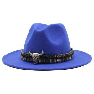 Detail of wool fedora with ethnic striped band and silver bull skull metal ornament
