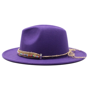 Detail of purple wool felt fedora with bohemian beaded band and rope knot decor