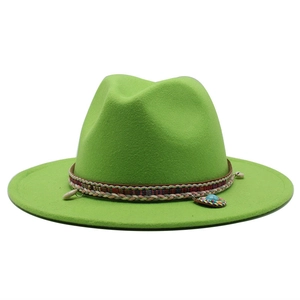 Detail of green felt fedora featuring ethnic woven band with turquoise beads and shells