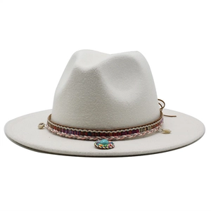 Detail of white wool fedora with ethnic woven band featuring turquoise beads and shell charms