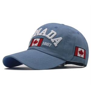 Detail of blue cotton baseball cap with CANADA embroidery and Canadian flag patch