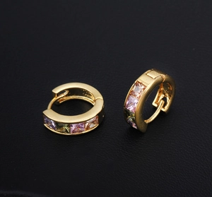 Macro shot of 18K gold plated hoop earrings with multicolored square zircon stones