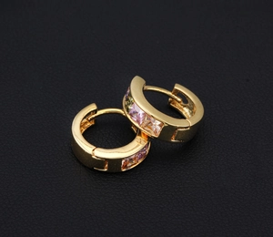 Detail of 18K gold plated hoop earrings featuring multi-color square cubic zirconia