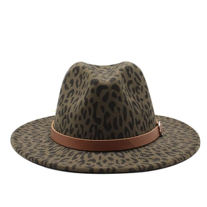 Elegant leopard print fedora hat with a wide brim and brown leather strap for men and women