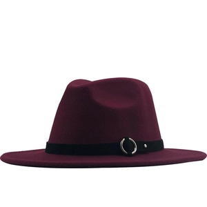 Detail of burgundy wool fedora hat featuring a black band with silver metal ring buckle