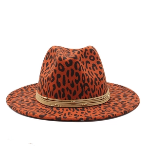 Macro view of leopard print fedora with brown beaded band and gold metallic accents