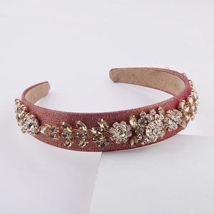Detail of pink baroque headband with handmade floral rhinestones and sparkling fabric