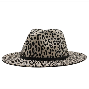 Detailed view of leopard print fedora hat with wide brim and black decorative band