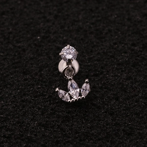 Macro shot of silver zircon labret stud with a three-stone marquise crown pendant
