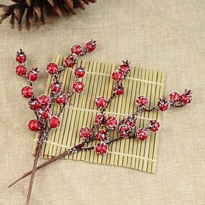 Artificial red holly berries with snow frost for Christmas tree and home decor