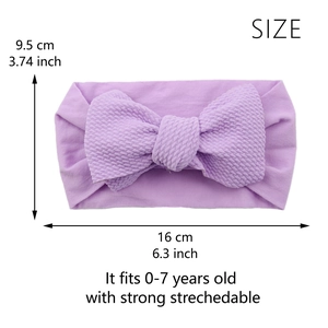 Detailed size chart of purple knotted baby headband with large bow and elastic fabric