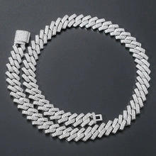 Macro shot of silver Cuban link chain with square clasp and diamond micro-pave detailing