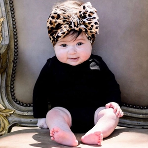 Baby leopard print bow headband styled with a black long sleeve infant bodysuit outfit