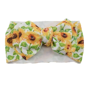 Infant sunflower print headband with a large bow on white elastic knitted fabric