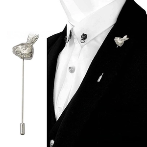 Macro shot of silver rabbit head lapel pin with long needle and protective metal cap