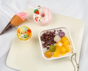 Detailed set of cute PVC dessert charms including ice cream and donuts on white plate