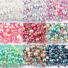 Macro shot of 3-5mm multi-colored mermaid round faux pearls for DIY jewelry making