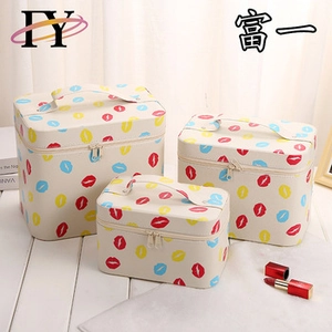 Three-piece set of cosmetic travel bags with vibrant lip print patterns and top handles