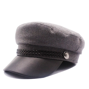 Classic dark grey wool baker boy hat with black leather brim and silver metal button