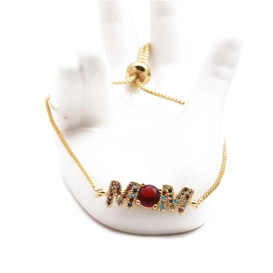 Adjustable gold MOM bracelet with red ruby center and colorful pave zircon accents