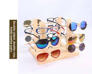 Double-sided wooden eyewear display stand holding 12 pairs of sunglasses in two rows