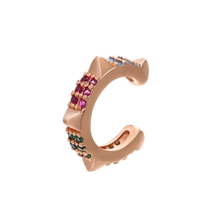 Macro view of rose gold ear cuff featuring multicolor zircons and punk spike details