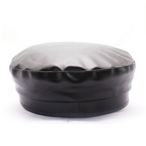 Detail of black PU leather flat top cap with metallic chain and reinforced stitching