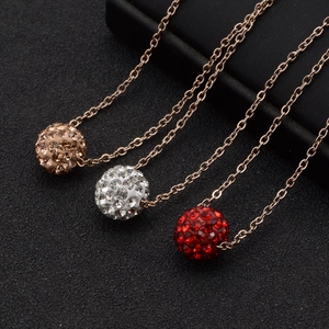 Three round sphere necklaces with full diamonds in gold, silver, and red tones