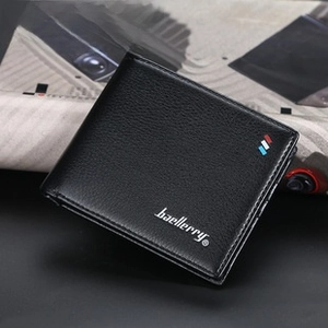 Detail of black bifold leather wallet with lychee grain texture and stripe accent