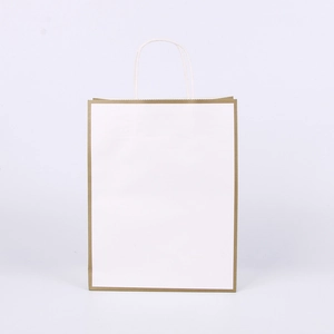 Detail of white shopping bag with golden frame border and durable paper handles