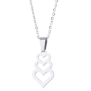 Macro detail of three layered hollow heart pendants on a silver stainless steel necklace