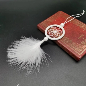 Handmade white dreamcatcher ornament with feathers and beads for car or bag decoration