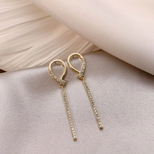 Elegant 925 silver long geometric tassel earrings with glittering crystals on beige silk
