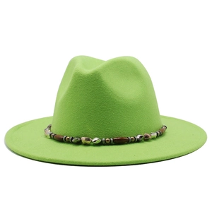Detail of lime green wool fedora hat featuring an ethnic beaded band with wooden beads
