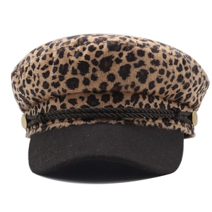 Vintage leopard print baker boy hat with black brim and golden button details