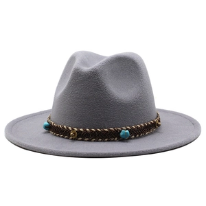 Detailed close-up of grey wool fedora hat with ethnic turquoise beaded hatband