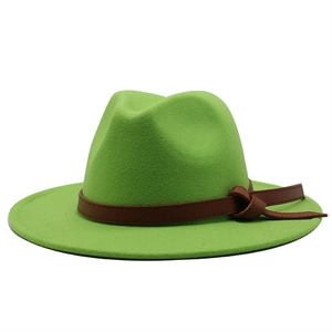 Detail showing grass green wool fedora with dark brown leather band and knot detail
