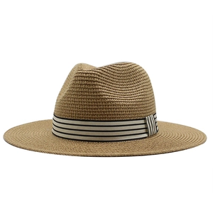 Classic straw fedora hat in natural tan with a black and white striped ribbon band