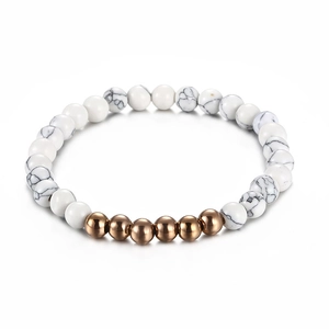 Minimalist white turquoise beaded bracelet with rose gold metal accents on white background